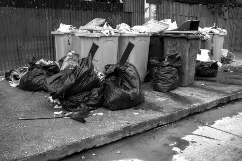 Workers wearing PPE during rubbish removal at an office